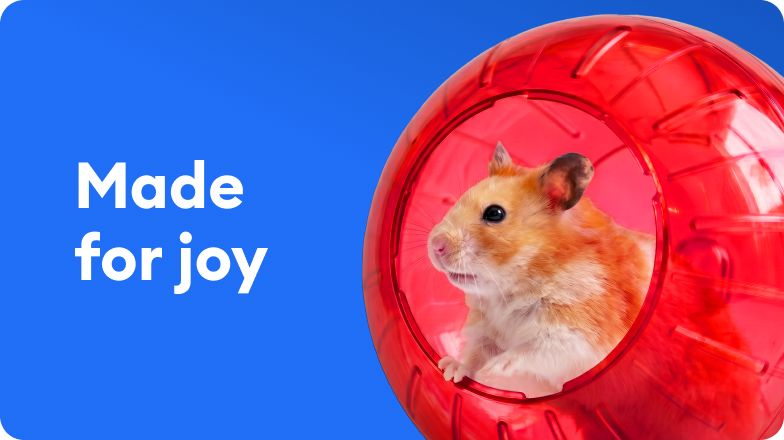 A hamster in red exercise wheel - Made for joy